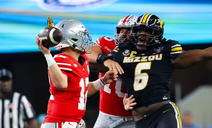 Dec 29, 2023; Arlington, TX, USA; Missouri Tigers defensive lineman Darius Robinson (6) rushes Ohio State Buckeyes quarterback Lincoln Kienholz (12) during the second half at AT&T Stadium. Mandatory Credit: Kevin Jairaj-USA TODAY Sports  